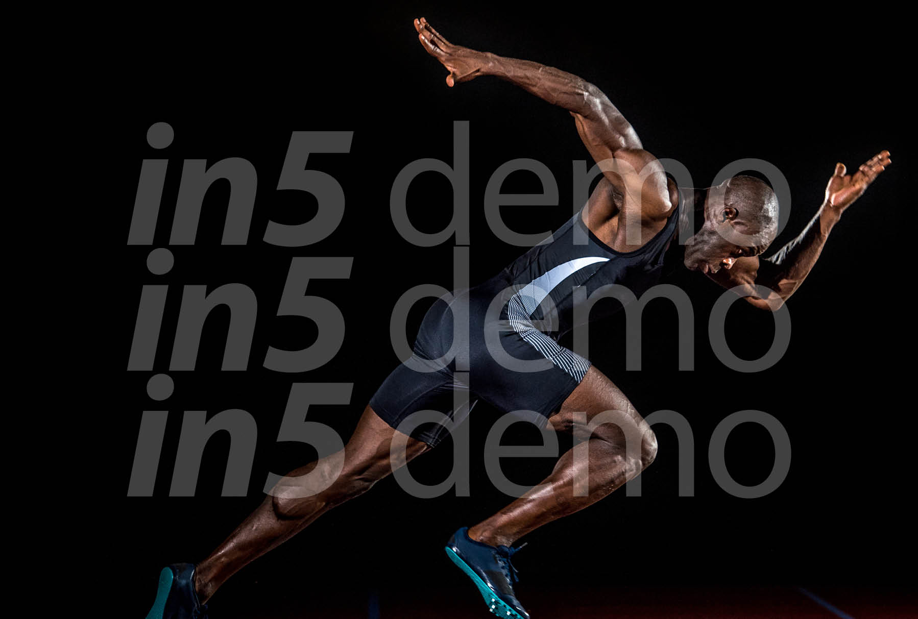 Young male athlete taking off from starting block 